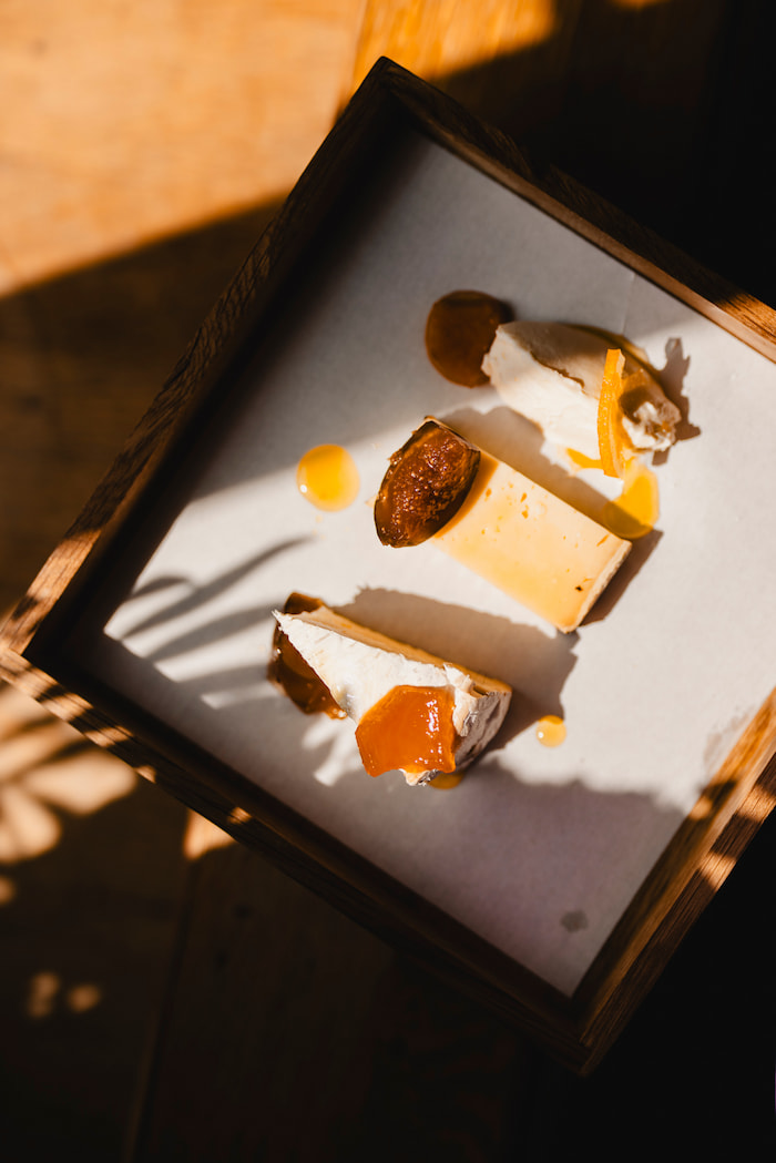 Portrait view of gourmet cuisine presentation: vertically composed shot highlighting the chef's attention to detail and artistic plating.